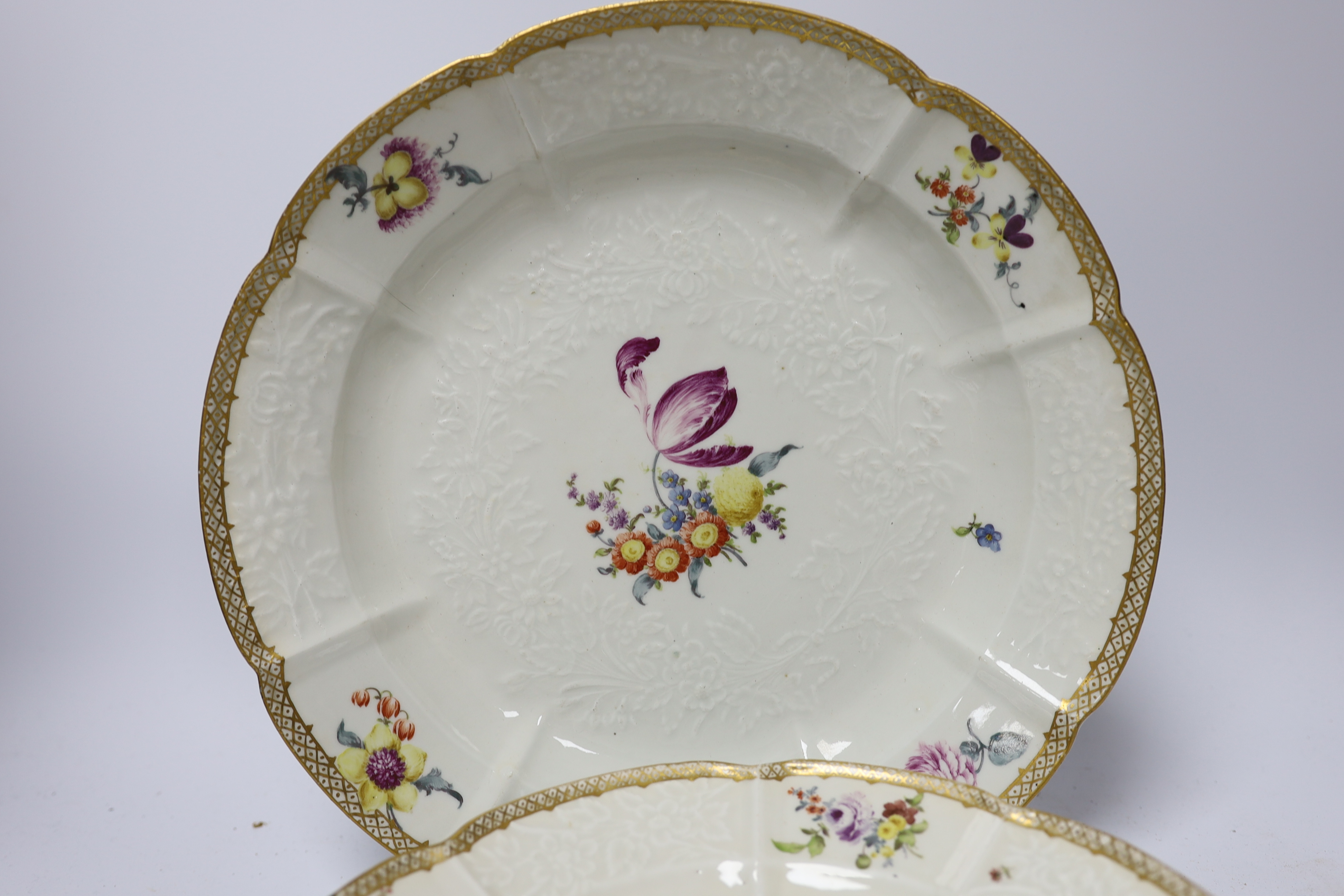 A large Meissen moulded porcelain dish and five matching plates, c.1760-70, each painted with Deutsche Blumen, dish 32cm diameter